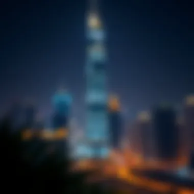 Night view of Viridis Tower illuminated against the Dubai skyline